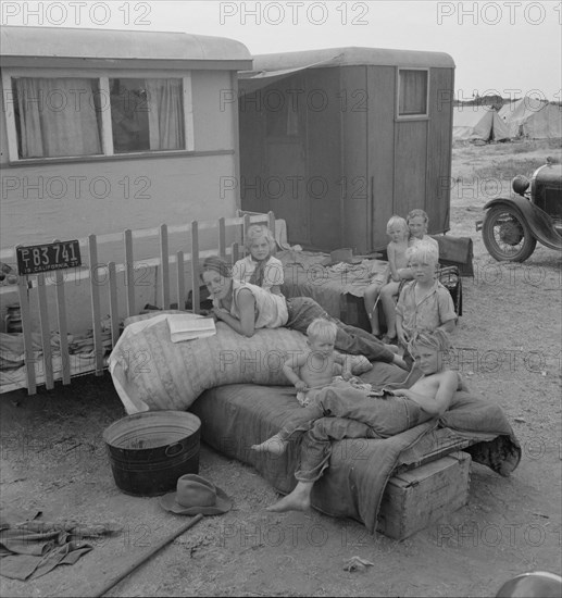 Children from Chickasaw, Oklahoma, in a potato pickers' camp near Shafter, California, 1937. Creator: Dorothea Lange.