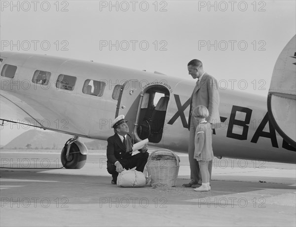 Plant quarantine inspector examining baggage, Glendale, California, 1937. Creator: Dorothea Lange.