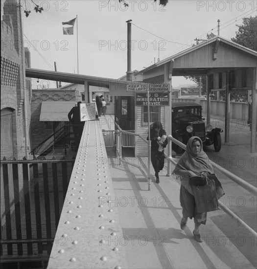 Crossing the international bridge between Juarez, Mexico and El Paso, Texas, 1937. Creator: Dorothea Lange.