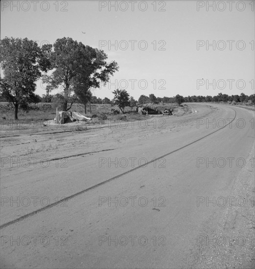 Family camped on U.S. Highway 63, Cache County, Oklahoma, 1937. Creator: Dorothea Lange.