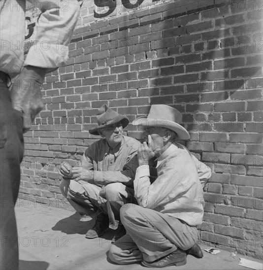 Farmers on street corner, Odessa, Texas, 1937. Creator: Dorothea Lange.