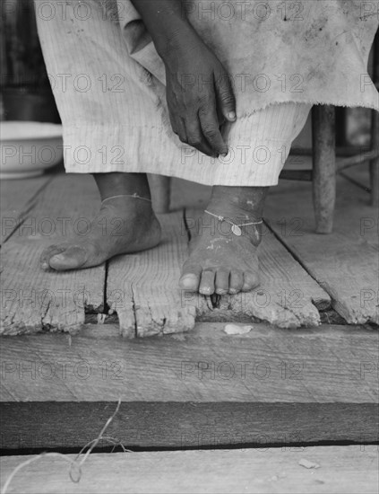 Fifty-seven year old sharecropper woman, Hinds County, Mississippi, 1937. Creator: Dorothea Lange.