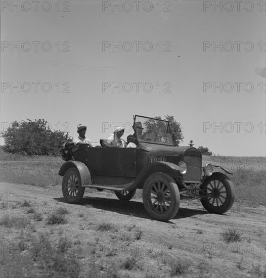 Negro family going to church, Ellis County, Texas, 1937. Creator: Dorothea Lange.