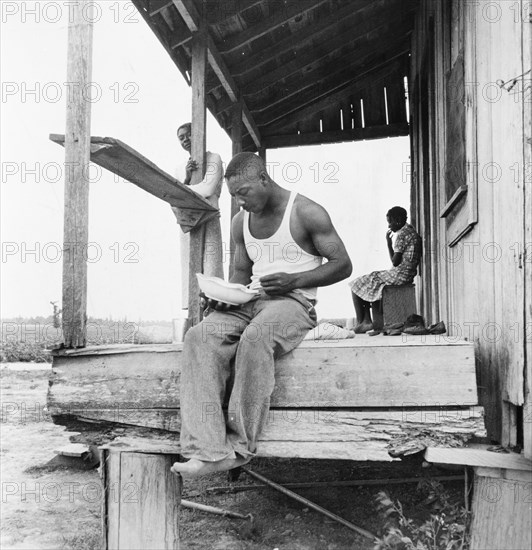 Sharecropper eating near Clarksdale, Mississippi, 1937. Creator: Dorothea Lange.