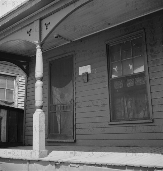 Furnish room in the Negro quarter from which cotton hoers are recruited, Memphis, Tennessee, 1937. Creator: Dorothea Lange.