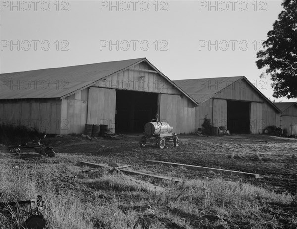 Tractor garage at the Aldridge Plantation near Leland, Mississippi, 1937. Creator: Dorothea Lange.