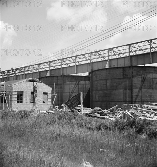 Large turpentine still and processing plant near Valdosta, Georgia, 1937. Creator: Dorothea Lange.