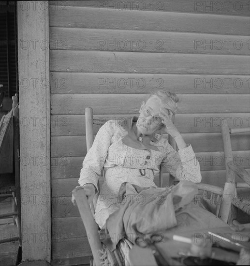 Southern lady on the veranda of the "Big House" at the Wray Plantation, Georgia, 1937. Creator: Dorothea Lange.