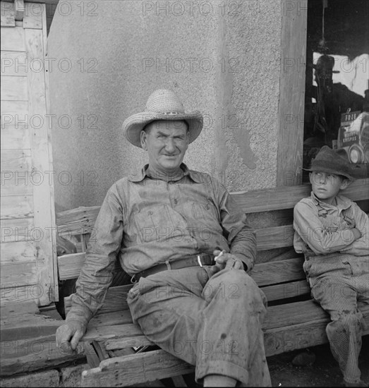 One of a group of western Oklahoma wheat farmers congregated at crossroads service station, 1938. Creator: Dorothea Lange.