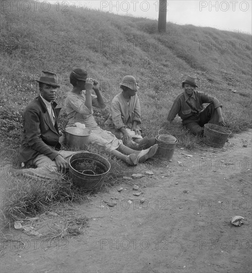 Berry pickers at 5 am, waiting for the truck to haul them to work, Memphis, Tennessee, 1938. Creator: Dorothea Lange.