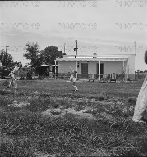 Sunday morning on the Baxter part-time farms project, Arizona, 1938. Creator: Dorothea Lange.