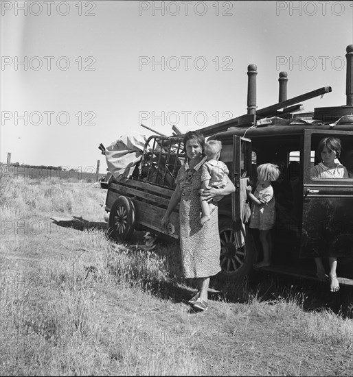 Migrant agricultural labor family, refugees from Texas, near Wasco, California, 1938. Creator: Dorothea Lange.