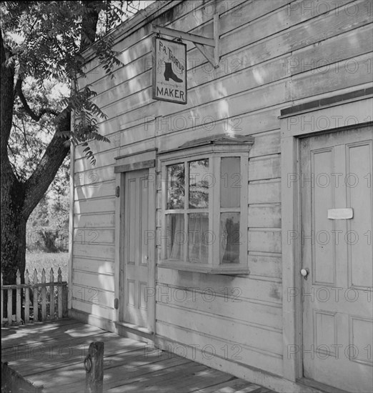 Boot and shoemaker shop in small California town, 1938. Creator: Dorothea Lange.