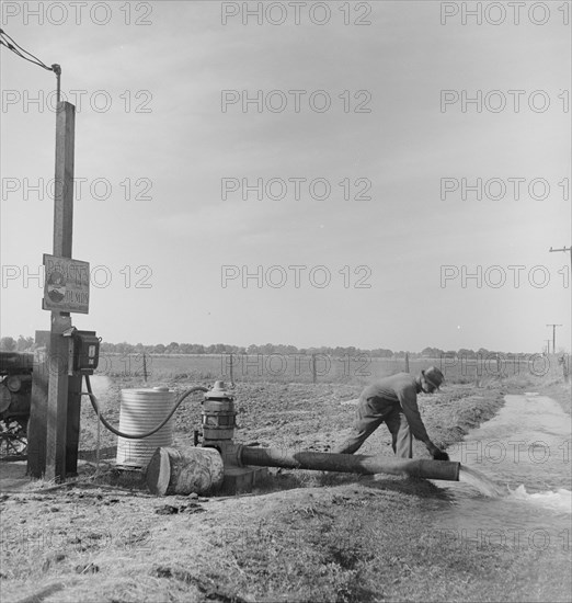 Irrigation pump on edge of field, San Joaquin Valley, California, 1938. Creator: Dorothea Lange.