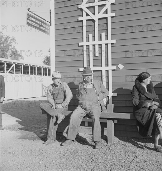 Lineup outside of Farm Security Administration grant office early in the morning, Tulare, CA, 1938. Creator: Dorothea Lange.