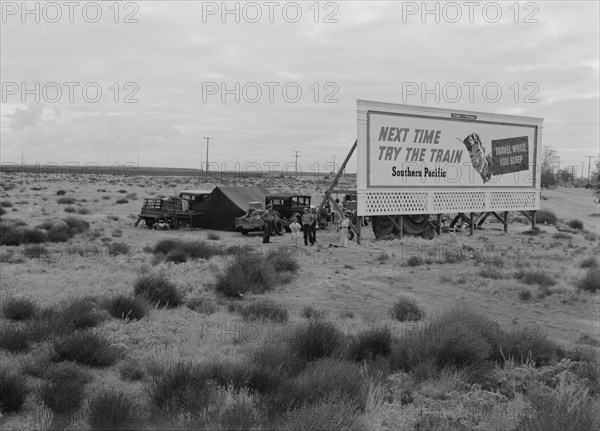 Three families camped on the plains along US99 in California, 1938. Creator: Dorothea Lange.