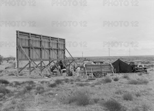 Three families camped on the plains along US99 in California, 1938. Creator: Dorothea Lange.