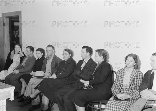 Night meeting in the FSA office, Tulare County, California, 1938. Creator: Dorothea Lange.