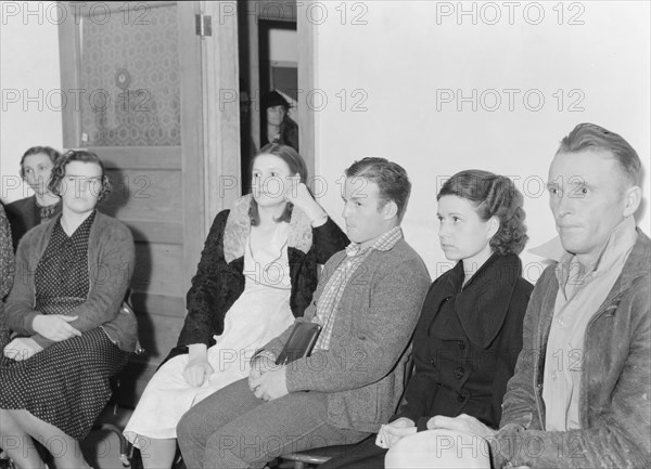 Night meeting in the FSA office, Tulare County, California, 1938. Creator: Dorothea Lange.