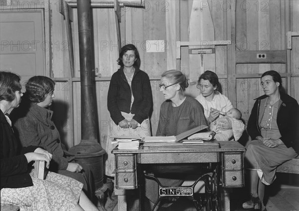 Meeting of the Mothers' Club in Arvin camp for migrant workers, Kern County, 1938. Creator: Dorothea Lange.