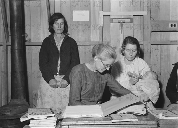 Meeting of the Mothers' Club in Arvin camp for migrant workers, Kern County, 1938. Creator: Dorothea Lange.