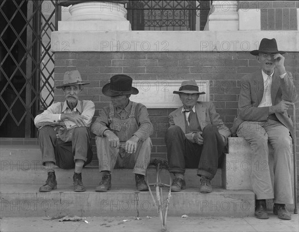 On the steps of the bank in the town square, Memphis, Texas, 1937. Creator: Dorothea Lange.