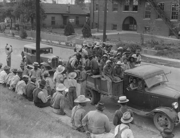 Cotton hoers loading at Memphis, Tennessee for the day's work in Arkansas, 1937. Creator: Dorothea Lange.