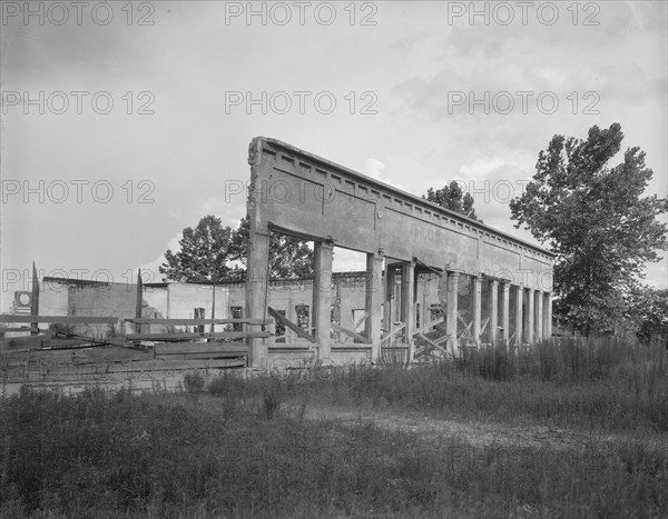 Remains of storefronts in Fullerton, Louisiana, an abandoned lumber town, 1937. Creator: Dorothea Lange.