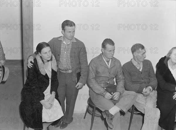 Night meeting in the FSA office, Visalia, Tulare County, California, 1938. Creator: Dorothea Lange.