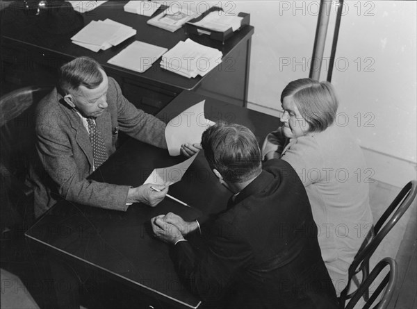 Night meeting in the FSA office, Visalia, Tulare County, California, 1938. Creator: Dorothea Lange.