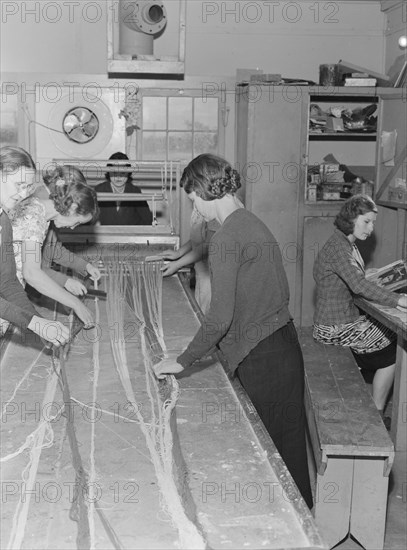 In the sewing room, Shafter camp for migrants (FSA,) California, 1938. Creator: Dorothea Lange.