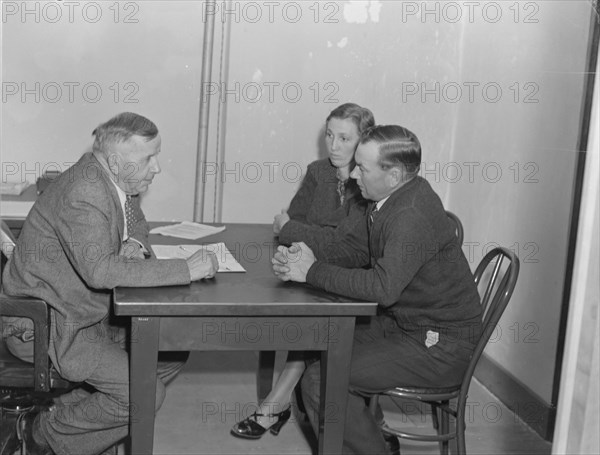 Night meeting in the FSA office, Visalia, Tulare County, California, 1938. Creator: Dorothea Lange.