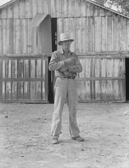 Small cotton farmer, Kern County, California, 1938. Creator: Dorothea Lange.