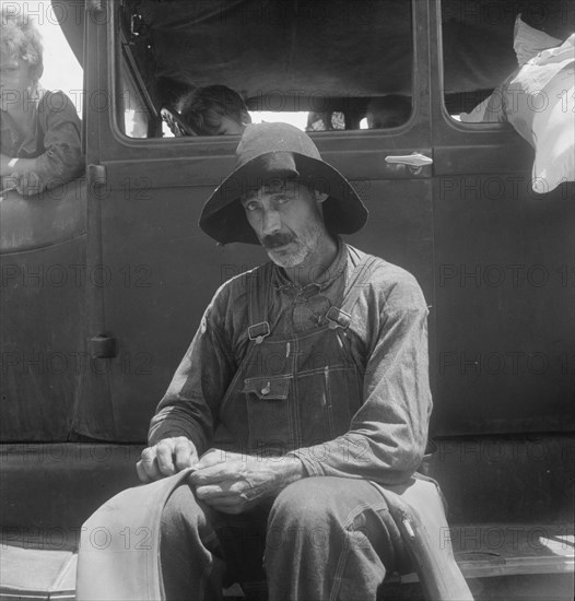 South Georgia tobacco sharecropper during the tobacco auction, Douglas, Georgia, 1938. Creator: Dorothea Lange.