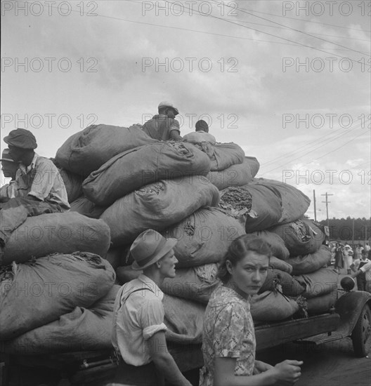 The "golden leaf," already graded by the farmers, sorted and wrapped..., Douglas, Georgia, 1938. Creator: Dorothea Lange.