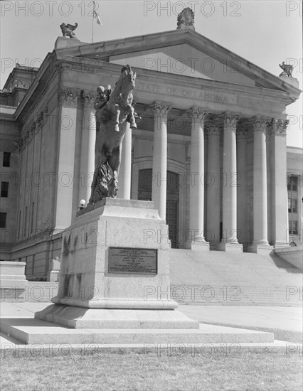 Oklahoma City state capitol, literally built on oil, Oklahoma, 1938. Creators: Dorothea Lange, Constance Whitney Warren.