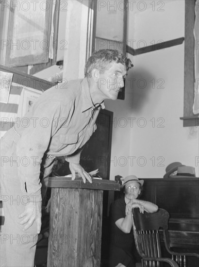 Speaker, migratory worker, Conference to Aid Agricultural Organization, Bakersfield, CA, 1938. Creator: Dorothea Lange.