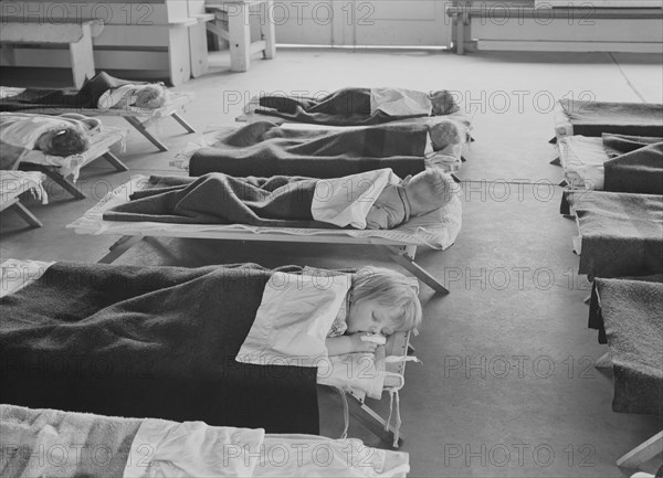 Rest time in nursery school for migrant children at Shafter Camp, California, 1939. Creator: Dorothea Lange.