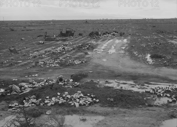 Debris left out on the flats where squatters' camp stood, Kern County, 1939. Creator: Dorothea Lange.