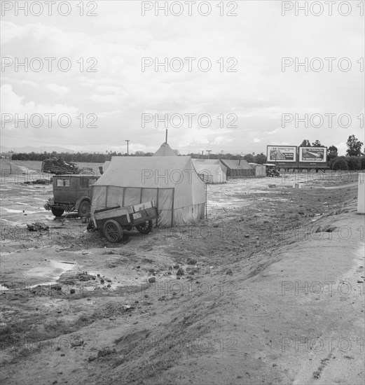 Winter quarters, migratory agricultural workers, beside the highway, Tulare County, CA, 1939. Creator: Dorothea Lange.