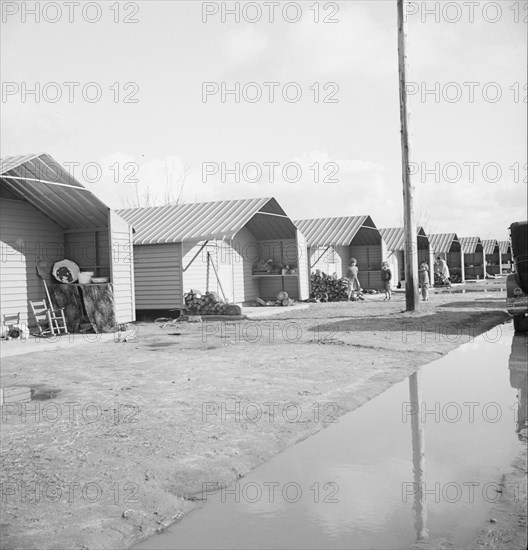 Prefabricated steel dwellings, Farm Security Administration, Farmersville, California, 1939. Creator: Dorothea Lange.