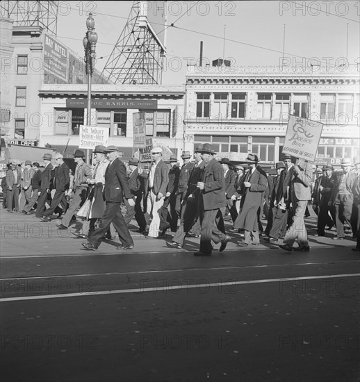 Mass meeting of WPA workers parading up Market Street, San Francisco, California , 1939. Creator: Dorothea Lange.