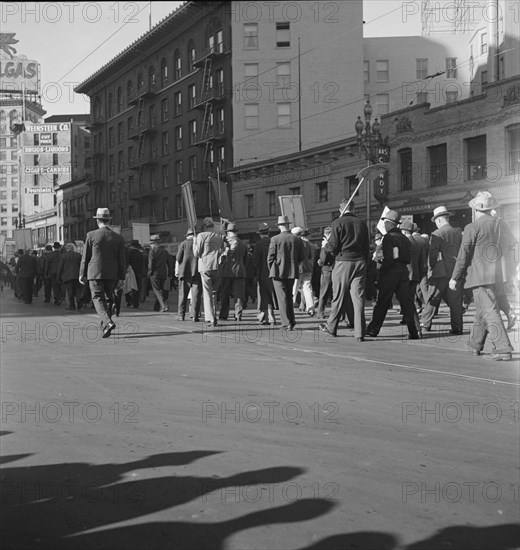 Mass meeting of WPA workers parading up Market Street, San Francisco, California , 1939. Creator: Dorothea Lange.