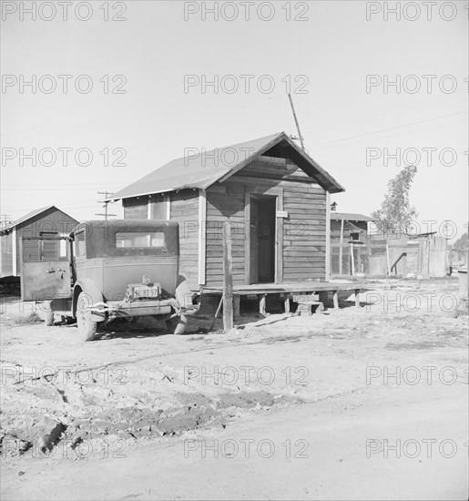 Newly-built cabins, rent five dollars per month, near Bakersfield, California , 1939. Creator: Dorothea Lange.