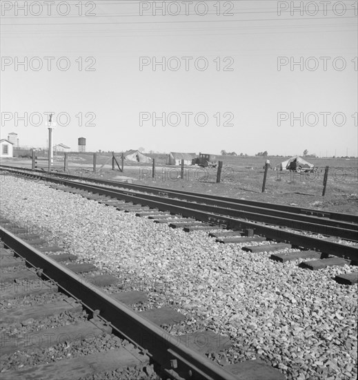 Migrants' tents...along the right of way of the Southern Pacific, near Fresno, CA, 1939. Creator: Dorothea Lange.