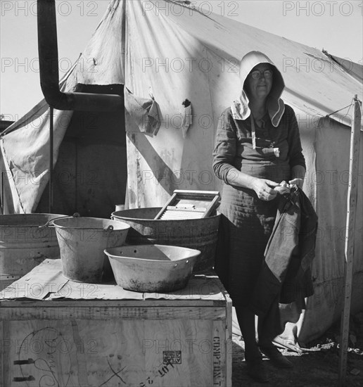 Texas woman in carrot pullers' camp, Imperial Valley, California, 1939. Creator: Dorothea Lange.