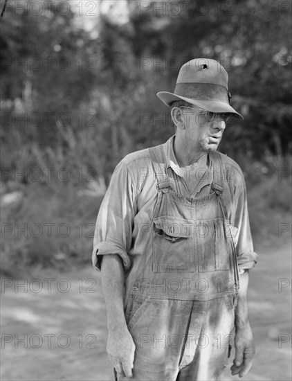 Possibly: Migratory worker in auto camp, Yakima Valley, Washington, 1939. Creator: Dorothea Lange.