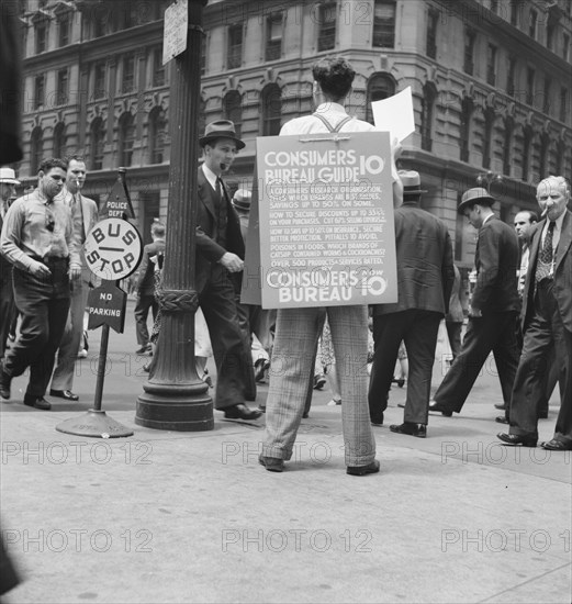 Street hawker selling Consumer's..., 42nd Street and Madison Avenue, New York City, 1939. Creator: Dorothea Lange.
