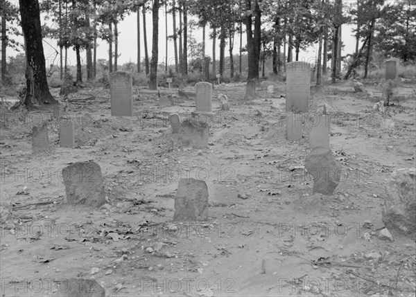 A red clay Negro cemetery, Bethel Hill High School, Person County, North Carolina, 1939. Creator: Dorothea Lange.