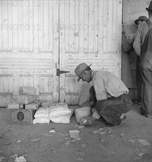 Outside the FSA grant office during pea harvest, Calipatria, California, 1939. Creator: Dorothea Lange.